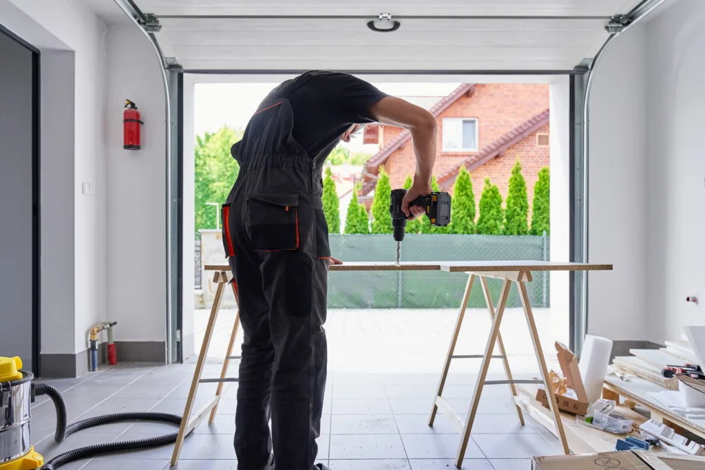man drilling wood panel in home garage workshop 2026 03 25 03 36 55 utc
