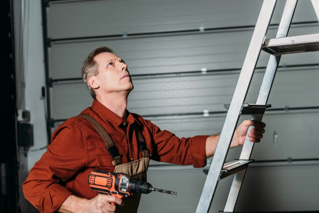 repairman climbing with screwdriver on ladder in g 2026 03 13 01 18 52 utc